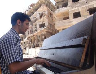 In Syrias starving Yarmuk camp, a pianist conjures hope