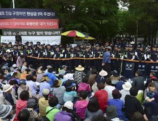 South Korean police storm compound in search for ferry owner in huge raid