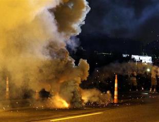 Two shot, dozens arrested in Ferguson after night of protests