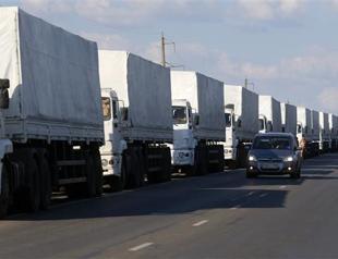Ukraine accuses Russia of invasion as aid trucks move in