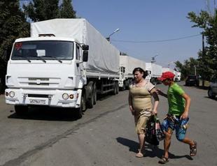 Tensions over Russian aid convoy as Merkel heads to Kiev