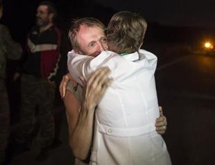 Ukraine, rebels exchange prisoners in peace deal