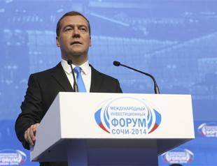 Russian PM Medvedev vows to keep economy open, hails pivot to China