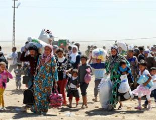 70,000 Syrian Kurds flee to Turkey amid border unrest