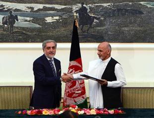 Afghanistans presidential rivals sign pact for power-sharing government