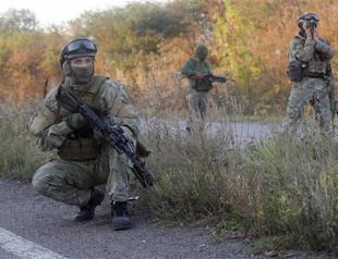 Ukraine says wont pull back troops without full ceasefire