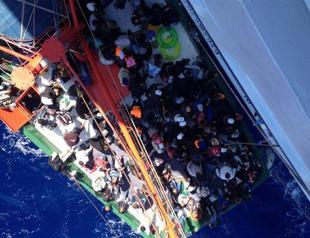 Rescued Syrian refugees disembark in Greek Cyprus after refusing to budge for hours