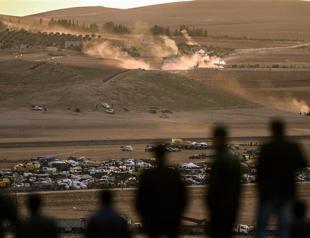 Turkey lets Kurdish fighters cross into Kobane