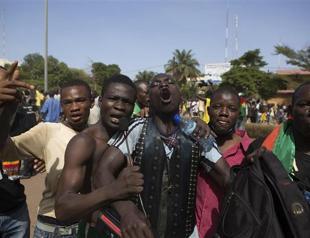 Burkina president steps down, calls for elections