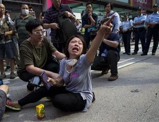 Hong Kong police clear protesters, barricades at key site