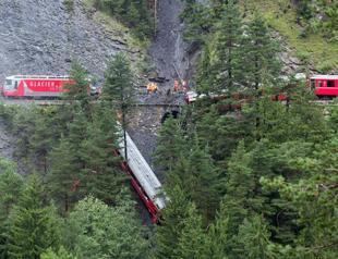 Swiss train carriage plunges into ravine after landslide