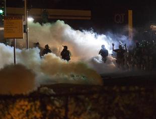 Police fire tear gas, stun grenades to disperse protesters in Missouri