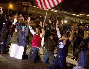 Grand jury decides against charges in Ferguson shooting, prompting nationwide protests