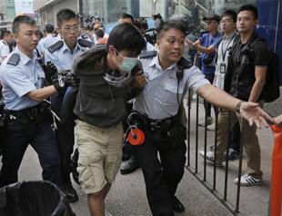 Hong Kong riot police clear protest site, arrest student leaders
