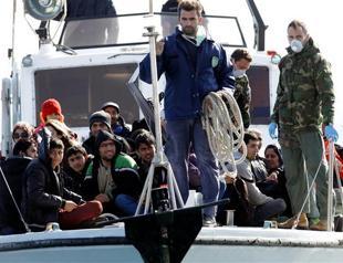 700 migrants begin disembarking on Greek island of Crete