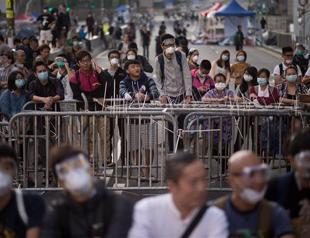 Clashes as masked men rush Hong Kong protest barricades