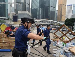 Hong Kong police haul away protesters from rally site