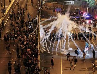 Hong Kong protesters defy tear gas and batons to renew democracy call