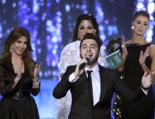 Syrian wins Arab song contest, keeps clear of politics