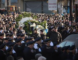Thousands of police attend funeral of slain New York cop