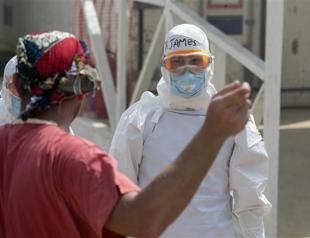 Health worker with Ebola transferred to London hospital