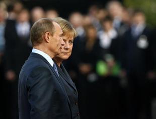 No Ukraine summit without progress on peace plan, Merkel tells Putin