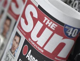 The Sun covers them up, ending topless tradition