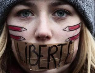 Tens of thousands march across Europe in solidarity with France