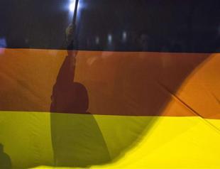 German anti-Islamists seize on terror fears with new rally as Merkel meets Davutoğlu