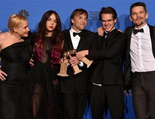 Boyhood wins big at Globes, stars salute French