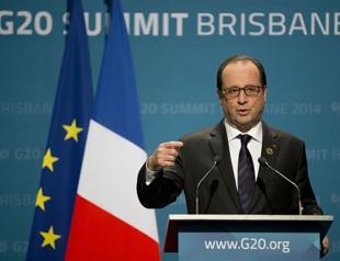 Hollande says wont be pressured over warship delivery to Russia
