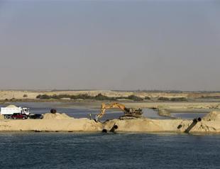 Egyptians race to expand Suez Canal, hoping for trade surge