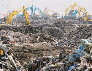 Four years on, Japans tsunami victims frozen in their tragedy