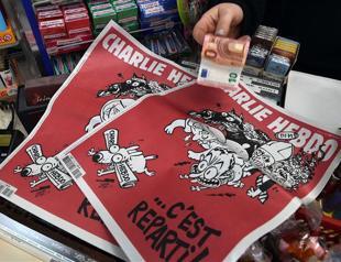 Two months after attack, splits at Charlie Hebdo over money