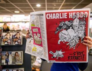 Charlie Hebdo team bites back with new issue