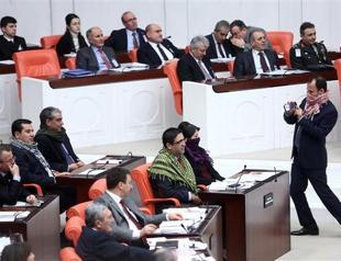 HDP deputies wear poşu at parliament to protest security bill