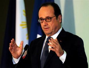 Hollande condemns French lawmakers meeting dictator Assad
