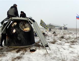 Astronauts return to Earth on Russian Soyuz spaceship