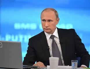 Putin sees return to growth in Russia in under 2 years