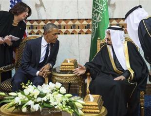 Obama lands in Saudi Arabia for talks with new king