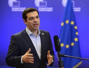 Tsipras presses for early Greek debt deal but flags referendum