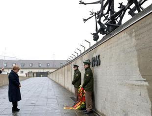 Merkel joins Holocaust survivors to mark Nazi camps liberation