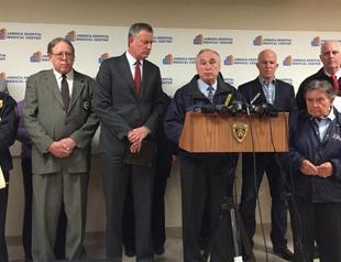 New York City police officer shot in head, suspect in custody