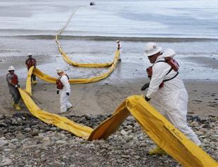 Cleanup of oil-fouled California beach could take months