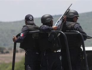 Families await 42 bodies, answers after Mexico gunfight