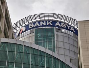 Bank Asya shares suspended from trading after takeover