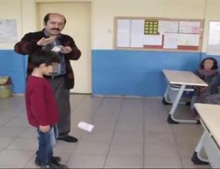 Probe launched into Turkish principal throwing money over students