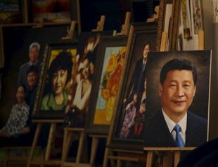 China detains artist who posted humorous photo of president