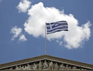 Greece ducks Friday deadline by bundling IMF payments