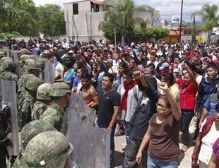 At least 10 dead as vigilantes clash in Mexico